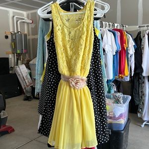 Yellow sundress with gold/tapue floral belt. Lace top.